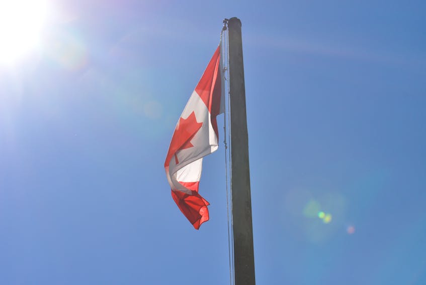 Exactly 215 hours after it was lowered, the Canadian flag at the Anglican Cathedral of St. John the Evangelist in Corner Brook was raised again on Wednesday to honour the 215 Indigenous children whose remains were found at a former residential school in Kamloops, B.C.