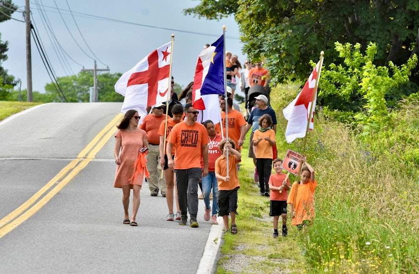 Some families took part in a Canada Day morning family walk to honour the children of residential schools. The walk and accompanying activities was seen as a time for reflection and to spread a message of reconciliation and healing. TINA COMEAU • TRICOUNTY VANGUARD 