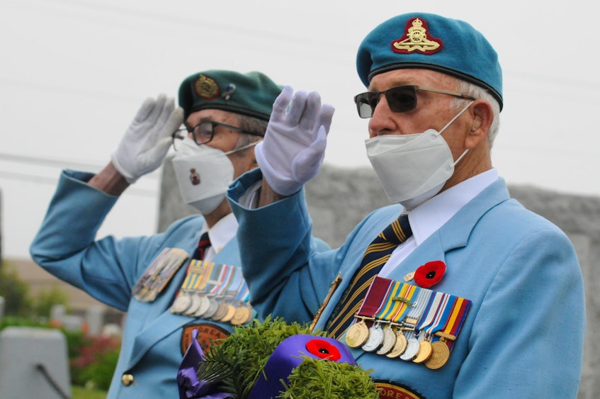 Korean War veterans Doug England (left) and Leslie Mercer. — Joe Gibbons/The Telegram