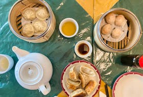Clockwise from top left: Shanghai soup dumplings, steamed shrimp balls and pan-fried pork dumplings are just some of the dim sum dishes at Jin Dragon, always served with lots of tea. GABBY PEYTON PHOTO