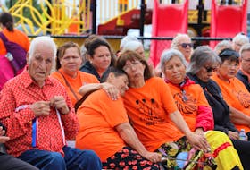 Elders and residential school survivors were seated at the front of the ceremony. Survivor Margaret Labobe-Provencher can be seen comforting fellow Survivor, Marlene Thomas.