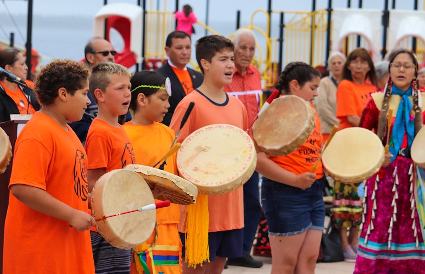 Students from the John J. Sark Memorial school perform the Mi'kmaq Honour Song at the Resiliency Day ceremony in Lennox Island on July 1. - Logan MacLean