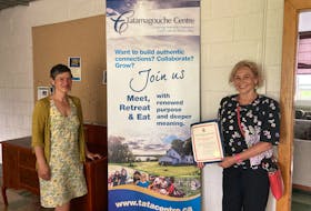 Cumberland-Colchester MP Lenore Zann presents Tatamagouche Centre executive director Nanci Lee with a certificate of appreciation. Tatamagouche Centre is receiving $120,000 in federal funding to make energy-efficient retrofits to its Stewart Hall.