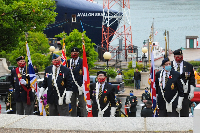Members of the Royal Canadian Legion colour party stand at ease during Thursday's ceremony in downtown St. John's. — Joe Gibbons/The Telegram