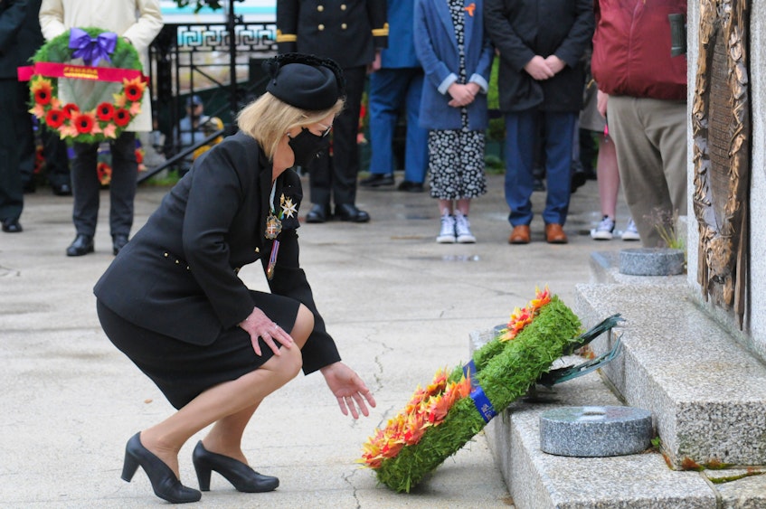 Lieutenant-Governor Judy Foote places the first wreath at the base of the National War Memorial. — Joe Gibbons/The Telegram