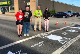 Twelve-year-old Aaliyah Pike (left), joined her dad, Paul Pike, Stephenville Mayor Tom Rose and Nona Matthews-Gosse from the Newfoundland Aboriginal Women’s Network for the opening of the town’s Indigenous crosswalk on June 25. Paul Pike designed the crosswalk. 