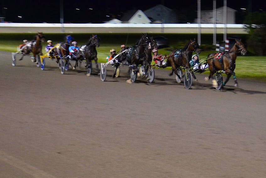 Time To Dance leads the field at the halfway mark of the 53rd running of the $25,000 Governor's Plate, presented by Summerside Chrysler Dodge, in 1:53.1 at Red Shores at Summerside Raceway on July 10.