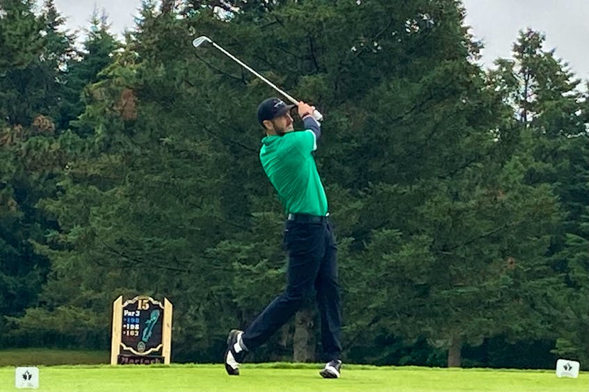 Ashburn's Brett McKinnon hits his tee shot on the par-3 15th hole at Avon Valley Golf and Country Club during Friday's first round of the Nova Scotia amateur championship. - Glenn MacDonald - Glenn MacDonald