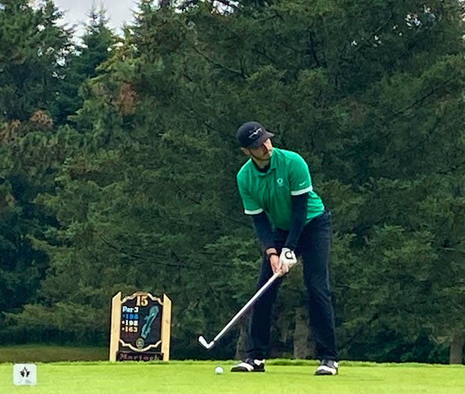 Ashburn's Brett McKinnon prepares to hit his tee shot on the par-3 15th hole during the Nova Scotia amateur golf championship at Avon Valley. - Glenn MacDonald