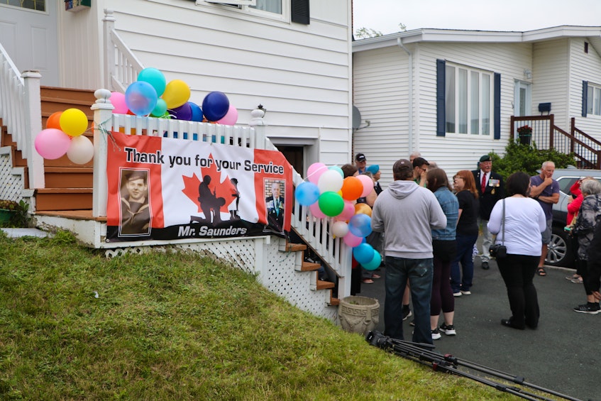 As part of the celebration of his birthday, banner and balloons were placed outside Saunders' home. — Glen Whiffen
