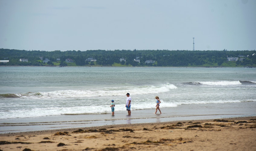Visitors to Conrod's Beach wade in the water along the shoreline on Monday, July 12, 2021. Tropical Storm Elsa left behind conditions for powerful riptides. RCMP were called twice to the beach on Sunday for calls of swimmers caught in the riptide.
Ryan Taplin - The Chronicle Herald - Ryan Taplin
