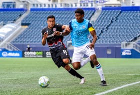 Andre Rampersad of the HFX Wanderers battles for the ball against Cavalry FC’s Jose Escalante during Canadian Premier League action on July 3 in Winnipeg. - Canadian Premier League