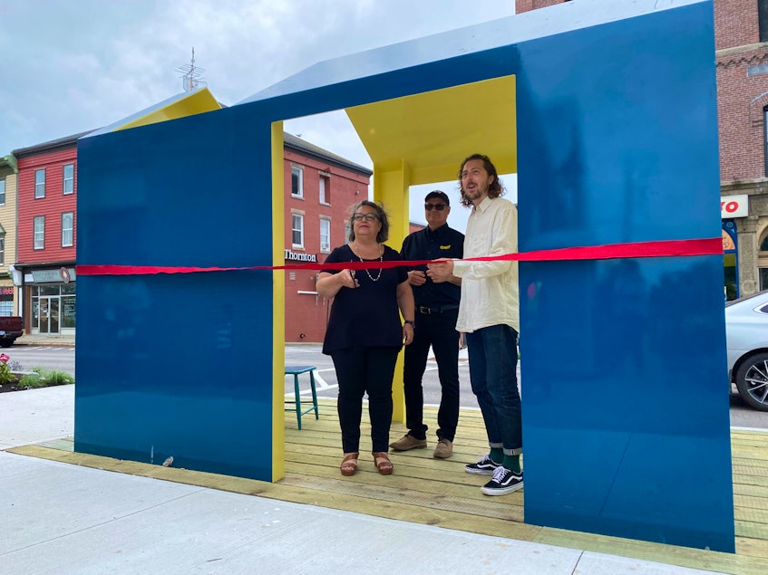 Mayor Pam Mood, Nicholas Robins, a Fathom Studio of Halifax landscape architect, and Ray Tynski a local business owner  cut the ribbon for the unveiling of new street art for Main Street.CARLA ALLEN • TRICOUNTY VANGUARD