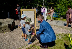 Nova Scotia premier Iian Rankin, speaks with a couple of youngsters prior to an announcement about early learning and child care on Tuesday at Mount Saint Vincent University's Child Study Centre, in Halifax. - Tim Krochak