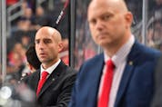 Mitch Love, hired by the Calgary Flames to be head coach of the Stockton Heat, has worked with Hockey Canada’s Program of Excellence, including this bench assignment alongside Andre Tourigny, right, at the 2018 Hlinka Gretzky Cup.