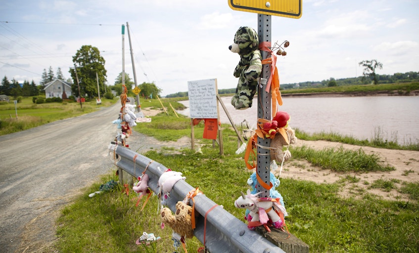An array of teddy bears are seen at a roadside memorial near the site of the former Shubenacadie residential school near Shubenacadie, NS Monday July 12, 2021. The site of the former residential school, is undergoing an electomagnetic survey for residential school burial sites. - Tim Krochak
