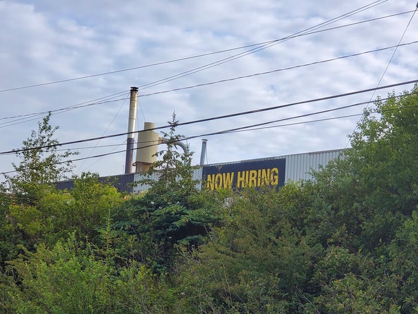 The 'Now hiring' sign on a Lewis Mouldings building survived the night and the fire. KARLA KELLY PHOTO - Contributed