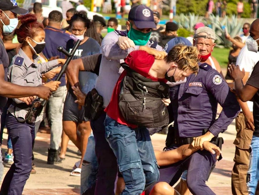 Security personnel clash with protesters in Cuba. - Contributed