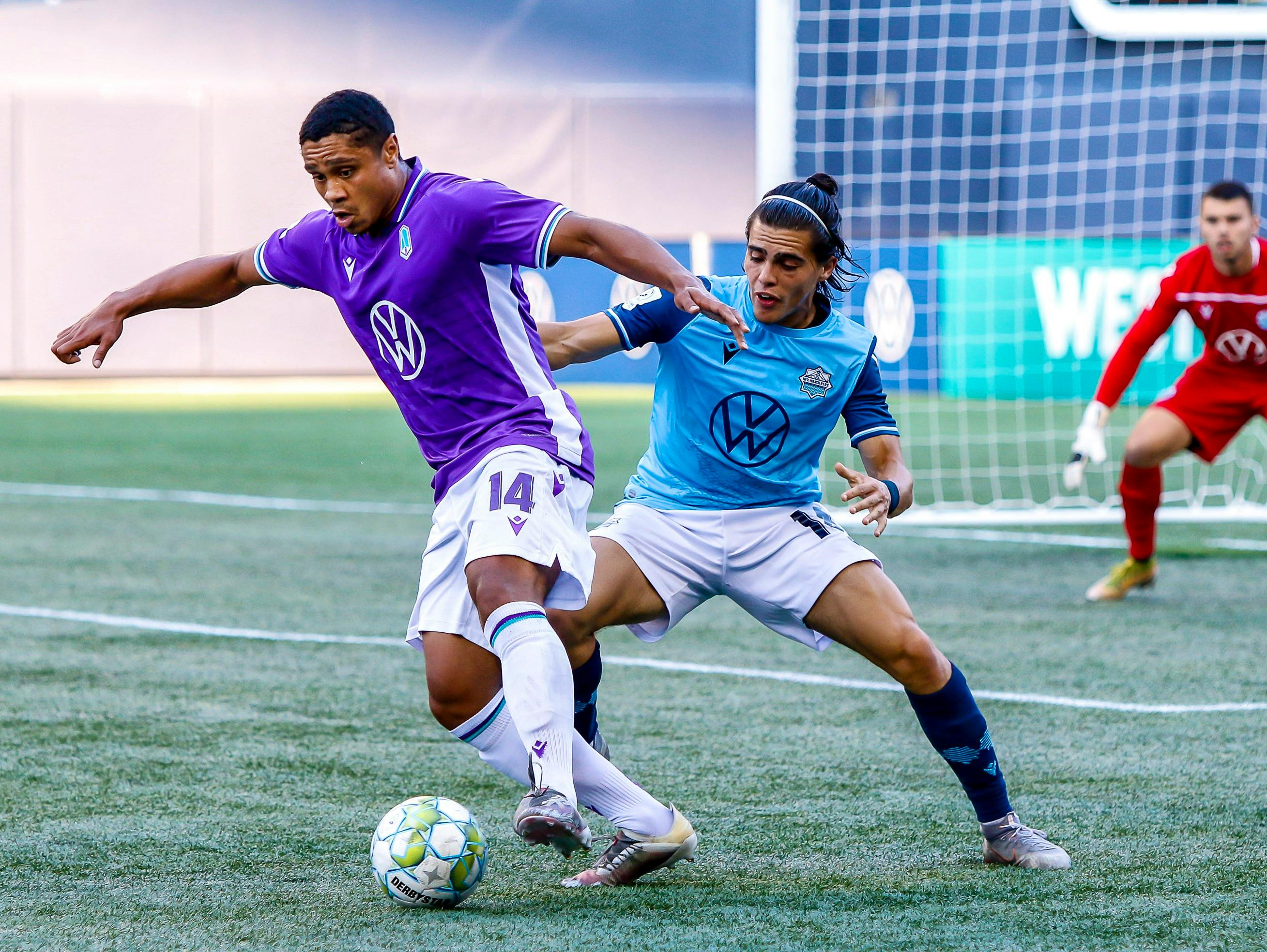 HFX Wanderers' Mateo Restrepo defends against Terran Campbell of Pacific FC as Wanderers keeper Christian Oxner looks on during a Canadian Premier League match Tuesday evening in Winnipeg. - Canadian Premier League