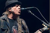  Neil Young, pictured performing in 2018, is one of the more than 100 authors, academics and celebrities who have signed a letter urging Prime Minister Justin Trudeau to scrap his plan to spend billions on new fighter jets. Alice Chiche /AFP