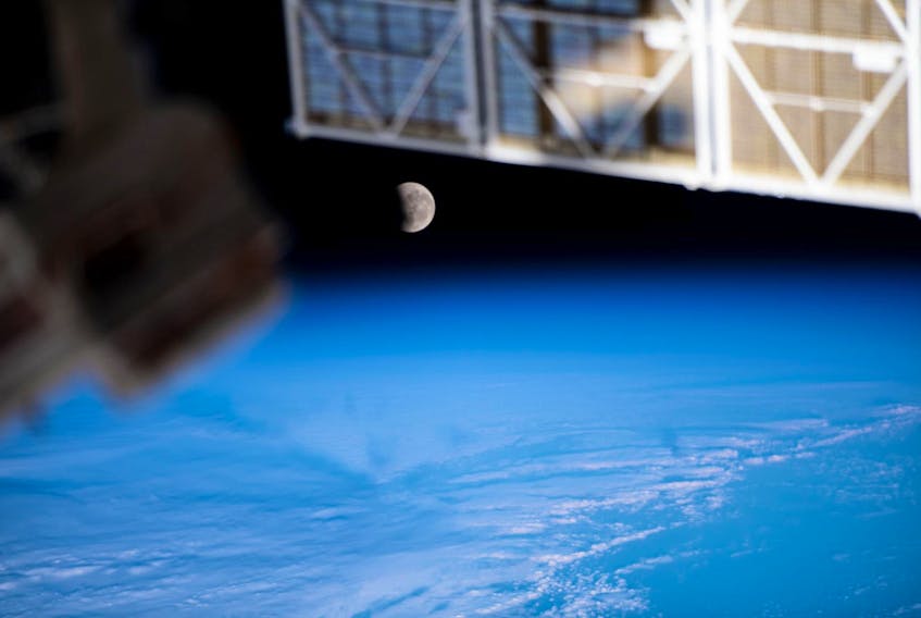 The moon, pictured during a lunar eclipse on May 26, 2021, is seen from the International Space Station during a northwest to southeast orbital trek 263 miles above the Pacific Ocean. When the sun is close to a lunar node, and the full moon is near the node as well, a lunar eclipse occurs. - NASA photo