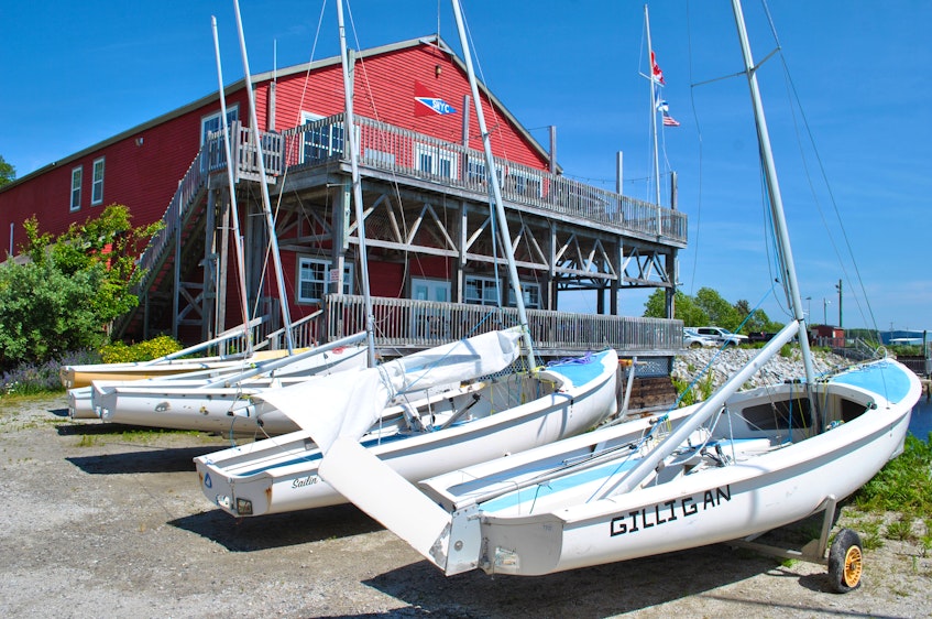 A fleet of small sailing dinghies line a bank at the Shelburne Harbour Yacht Club. KATHY JOHNSON - Kathy Johnson