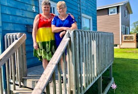 Susan MacNeil, left, stands with her best friend Florence Nearing on the front porch of the home MacNeil shared with her late husband Michael (Charlie) MacNeil for 40 years. NICOLE SULLIVAN/CAPE BRETON POST 