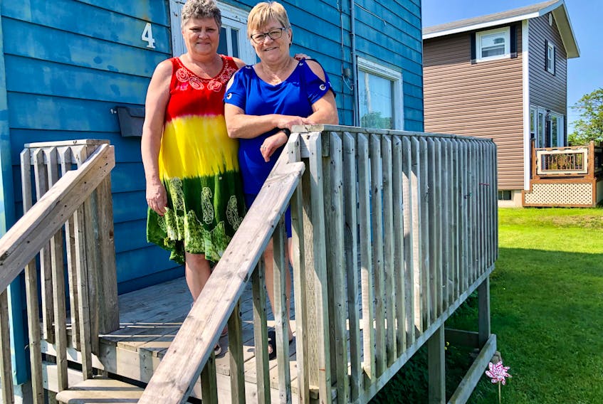 Susan MacNeil, left, stands with her best friend Florence Nearing on the front porch of the home MacNeil shared with her late husband Michael (Charlie) MacNeil for 40 years. NICOLE SULLIVAN/CAPE BRETON POST 
