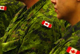 Files: Canadian flag shoulder patches on army armed forces uniforms. 