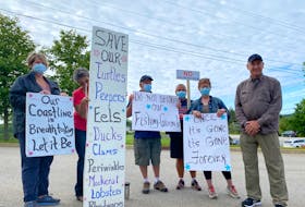 Protesters express concern over proposed salmon farm in Chebogue, on July 14 in front of the Yarmouth Municipal Building in Hebron.
CARLA ALLEN • TRICOUNTYVANGUARD