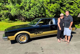 Russ and Dawn Hallbauer with the freshly restored 1978 Oldsmobile 442 that Russ bought new 43 years ago. Alyn Edwards/Postmedia News