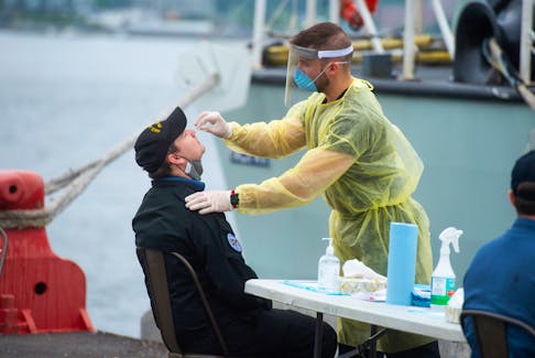 A sailor from HMCS Halifax gets a PCR test at CFB Halifax on Monday, July 19, 2021. The Halifax returned home on Monday as scheduled, however, a member of the crew tested positive for COVID-19 so the entire crew needed to get tested upon their arrival.