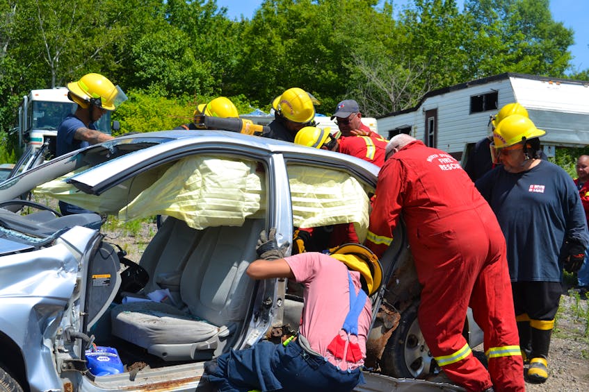 Volunteer firefighters from We'koqma'q and Wagmatcook First Nations joined North Sydney fire chief, Lloyd MacIntosh, and some of his crew for a weekend of training. MacIntosh took a hands-on approach to teaching the basics of how to remove a person trapped in a motor vehicle crash using the Jaws of Life and other equipment. ARDELLE REYNOLDS/CAPE BRETON POST 