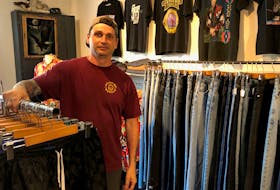 Robbie Carruthers stands inside his vintage clothing store Tuck N Roll in Charlottetown, P.E.I.