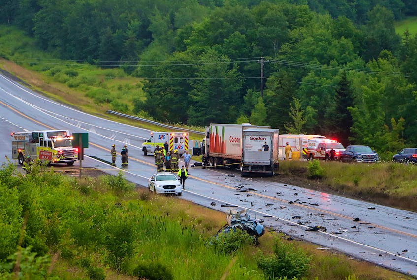 Firefighters along with RCMP officers and EHS paramedics responded to a two-vehicle collision involving a car and a tractor trailer near Exit 13 (North Alton) on July 18.
ADRIAN JOHNSTONE
