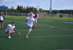 Place-kicker Yannick MacPhee of Charlottetown practises field goals at the Terry Fox Sports Complex in Cornwall on July 14. Zackary Blood is the holder. MacPhee will play his first-ever tackle football game with Team P.E.I.’s under-18 club at the Atlantic Bowl in Antigonish, N.S., on July 21.