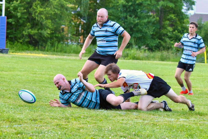 With the ball knocked loose, both the Tars and Valley Rugby Union players attempt to gain possession. The Tars won the bout 15-10. Both teams scored twice but the Halifax team converted one try and kicked a penalty.