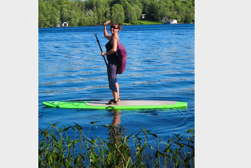 Joy Nicholson has developed a passion for teaching yoga during the past 15 years. Part of her business is stand up paddleboard yoga, which she offers to clients on Shortts Lake, near Brookfield.