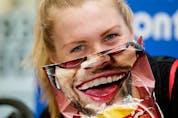  Canada’s Joanna Brown goofs around with a potato chip bag while taking part in an ITU World Triathlon Edmonton press conference in Hawrelak Park in Edmonton on July 27, 2017.