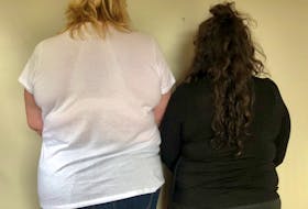 A middle-aged trans woman and a middle-aged cis woman standing beside each other for comparison of size. For a transgender woman to be approved for breast surgery by Nova Scotia health coverage, they are judged on need based on the Tanner Scale, which uses five levels to explain body development on cis female and male anatomy from puberty to maturity. CONTRIBUTED 