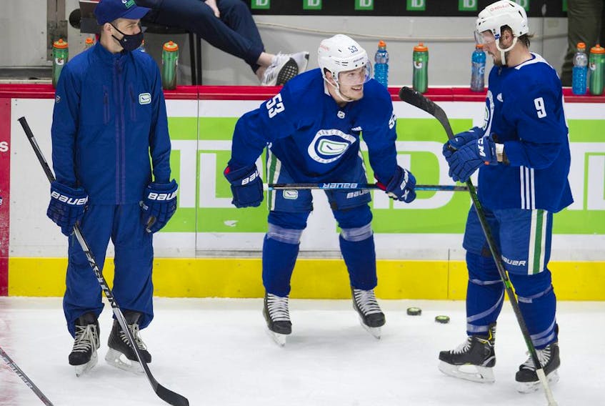 Vancouver Canucks captain Bo Horvat, centre, during training camp at Rogers Arena in January 2021.