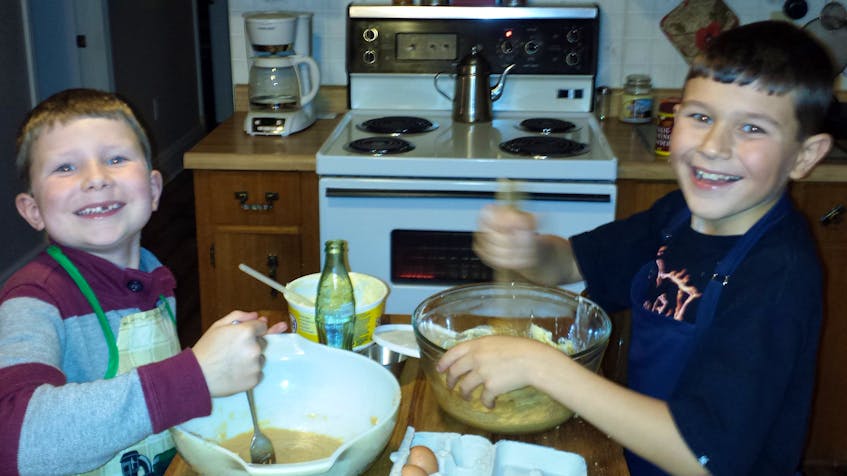 There’s nothing sweeter or tastier than a good chocolate chip cookie. But cookies can also play a role in creating fond memories. Seen here are Jake and Ross MacIntyre, happily whipping up a batch of homemade cookies from a recipe their mother Cora has used for decades. A resident of Georgetown Royalty, PEI, Cora herself was taught the recipe by her mother, who in turn received it from a neighbour back when Cora was a youth in her native Ontario.