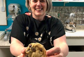 If you ever have a craving for a tasty chocolate chip cookie, chances are you won’t have to go far to find what you’re looking for, as the classic morsel is a staple at bakeries both large and small. Dianne Fullerton, owner of the Borrowed Kitchen’s Sugar Shack in Alexandria, PEI, shows off a freshly-baked cookie loaded with chocolate chips.  