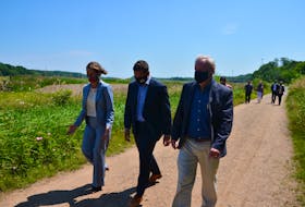 Kentville Mayor Sandra Snow, Kings-Hants MP Kody Blois and Kings South MLA and Environment and Climate Change Minister Keith Irving take a stroll down the Harvest Moon Trail following their respective funding announcements for active transportation lanes, pathways and crossings in Kentville. KIRK STARRATT