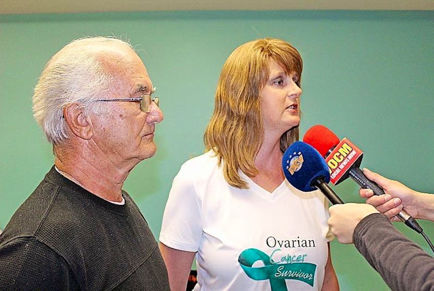 Jeff Blackwood and Susan Glynn speak with media about a petition calling for designated parking for patients receiving cancer treatment at the Dr. H. Bliss Murphy Cancer Centre in this 2016 file photo.