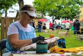 Rug hooking artist Isabel MacWilliams worked away at her craft on the second day of the Summerside Arts Festival.