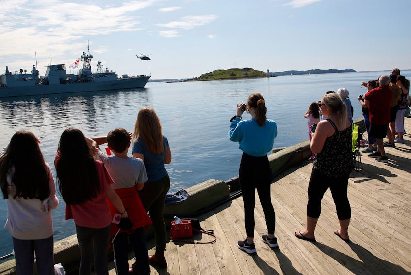 FOR NEWS STORY:
Friends and family line the waterfront as they bid bon voyage to HMCS Fredericton as the ship leaves for a 6 month  NATO deployment in the North Atlantic, on Operation Reassurance, in Halifax Saturday July 24, 2021.

TIM KROCHAK PHOTO