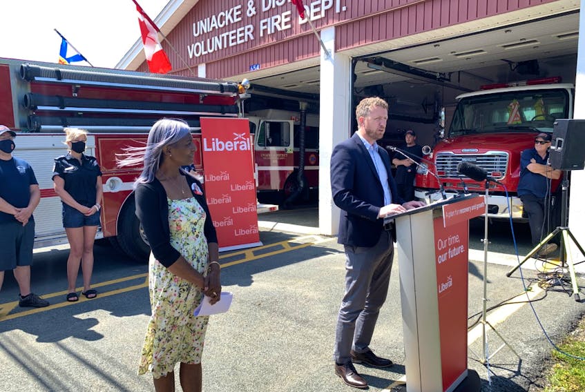 Liberal Leader Iain Rankin announced during a campaign stop in Mount Uniacke on Sunday that fire halls in the province are now eligible for federal funding for infrastructure repairs. At left is Sackville-Uniacke Liberal candidate Donalda MacIsaac.