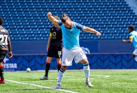 Alessandro Riggi celebrates a goal by HFX Wanderers  teammate Pierre Lamothe during a CPL win over Valour FC in Winnipeg on Saturday. - Canadian Premier League