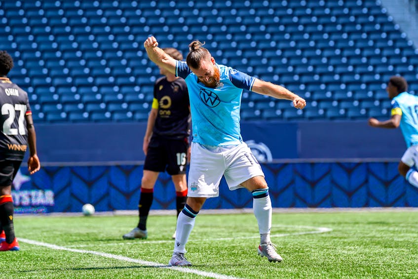 Alessandro Riggi celebrates a goal by HFX Wanderers  teammate Pierre Lamothe during a CPL win over Valour FC in Winnipeg on Saturday. - Canadian Premier League